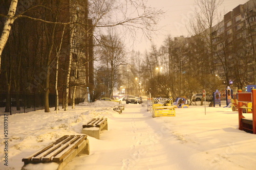 Snow covered roads in the city block at night