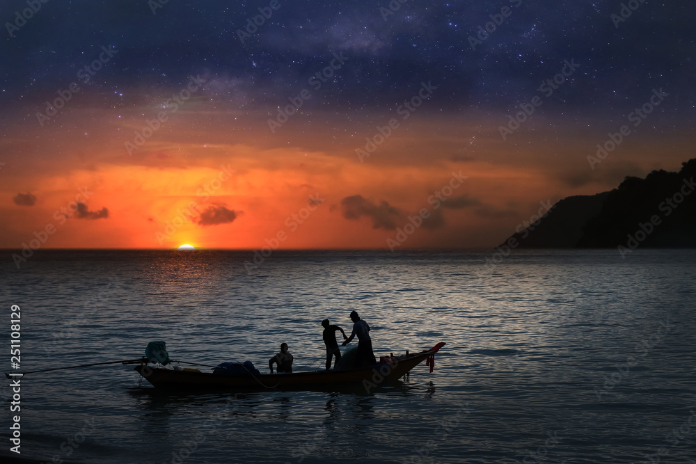 Local fishermen on a long-tail boat in the sea with million stars galaxy