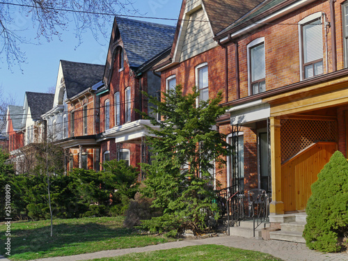 Photography street of restored Victorian brick row houses with gables