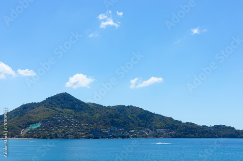 Blue sky and ocean in cleary day, have Phuket island that can see a lot of hotel near beach on mountain © TeeRaiden