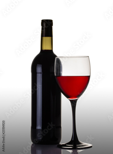 bottle and glass of red wine