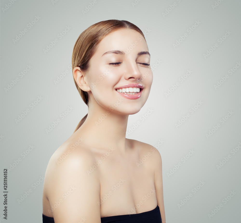 Pretty smiling woman portrait. Beautiful girl face with clear skin portrait Pretty smiling woman portrait. Beautiful girl face with clear skin portrait