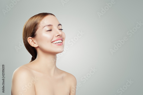 Young woman enjoying and relaxing on white background. Cheerful girl portrait