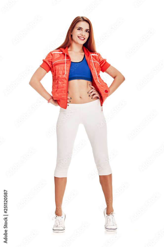 Young fit woman in sportswear showing her slim athletic body Young fit woman in sportswear showing her slim athletic body