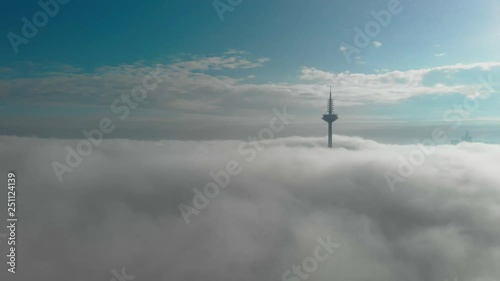 Aerial view of Frankfurt city Europaturm in heavy fog. photo