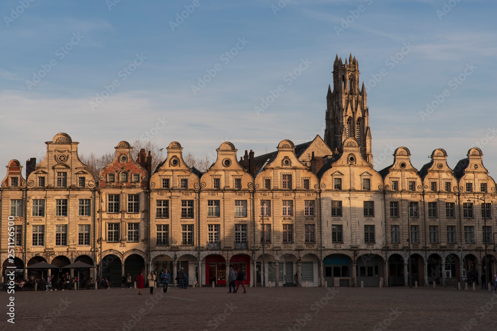 Fototapeta premium Typical Flemish medieval house facades on a square with a church behind