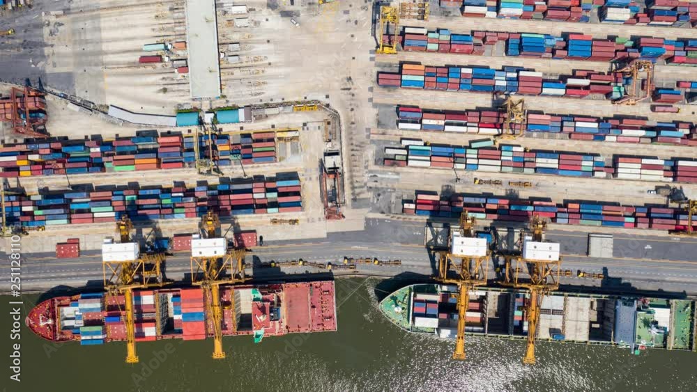 Hyper Time Lapse of aerial view of container ships and a port in export and import business and logistics in Thailand. Water transport International. Hyper Time Lapse of aerial view of container ships and a port in export and import business and logistics in Thailand. Water transport International.