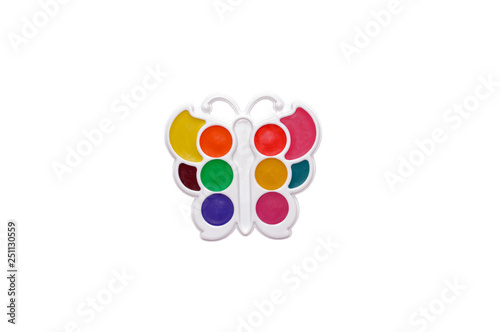 Colored watercolor paints on a palette for drawing pictures isolated on white background