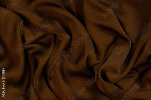 Texture of soft and shiny chocolate silk