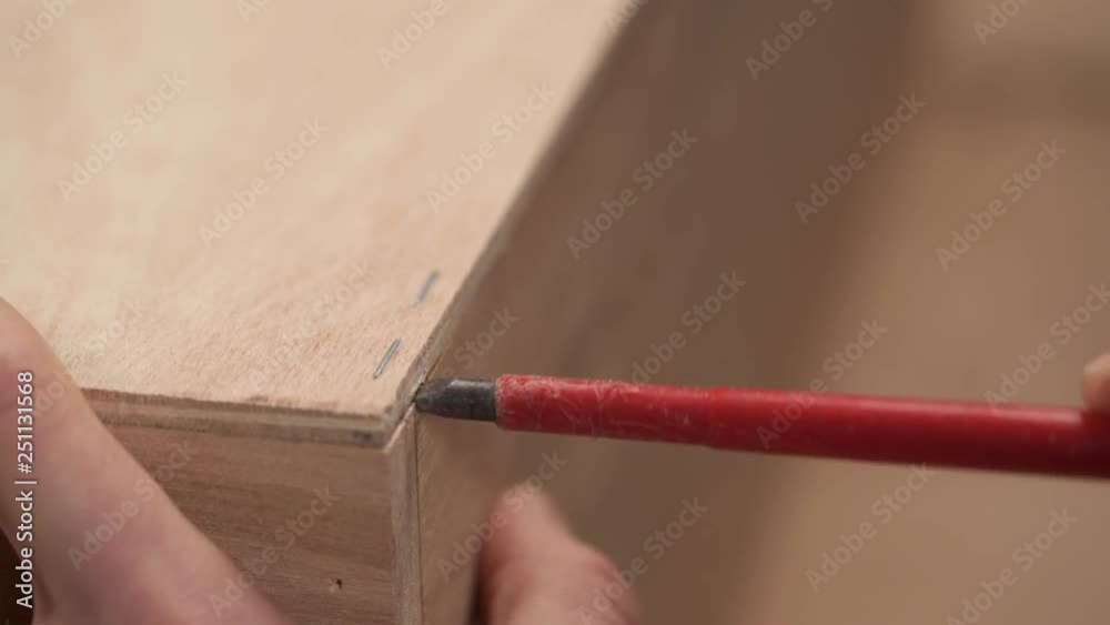 A closeup video of two methods of taking out from plywood board