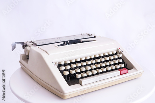 Vintage white typewriter isolated on white background,Auto red button