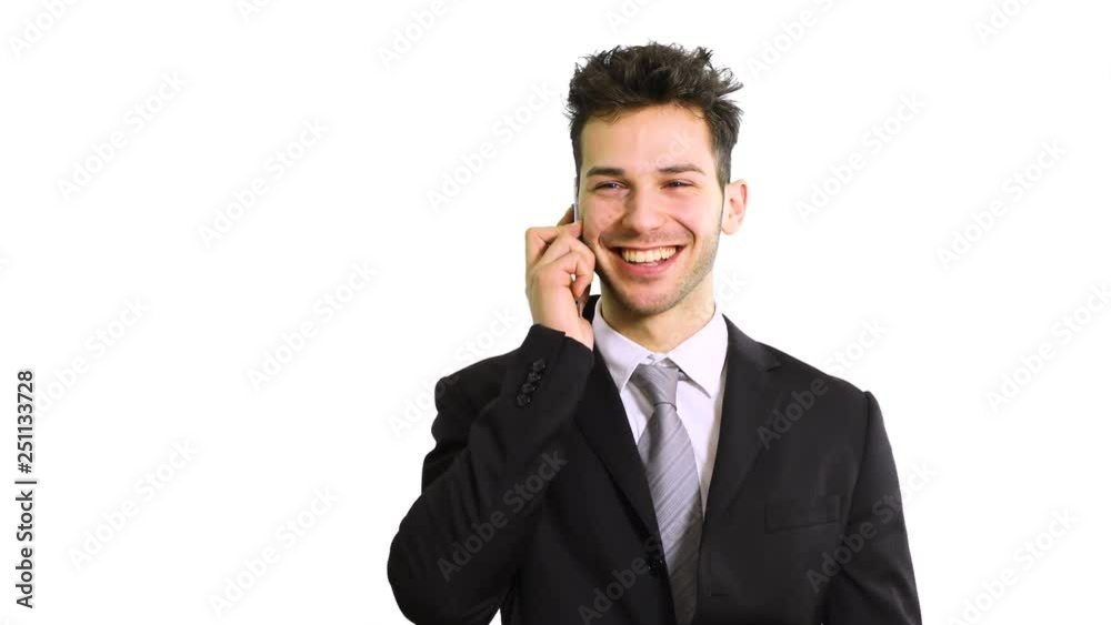 Smiling businessman talking at the phone Smiling businessman talking at the phone