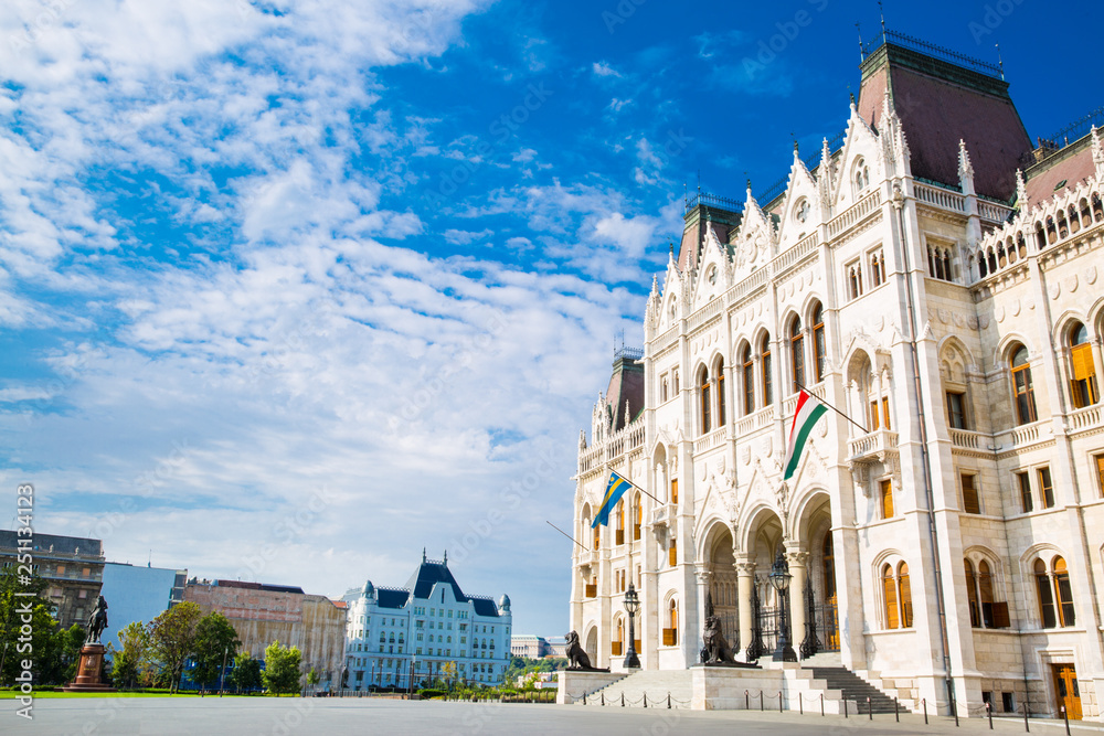 The entrance of Parliament in Budapest, Hungary. Bright summer day with blue sky. 