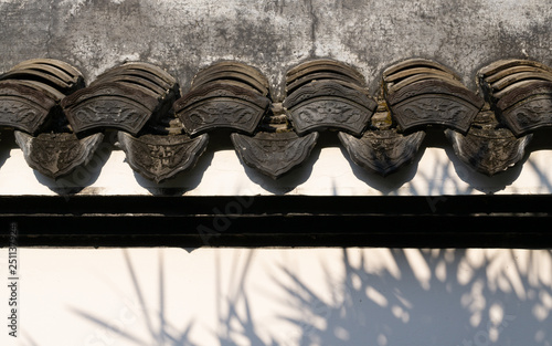 Traditional beautiful ancient chinese textured on the wall of Chinese building in the garden