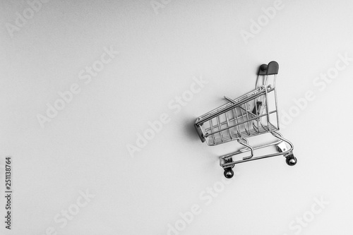 Shopping cart on black and white background, business and shopping concept. Selective focus