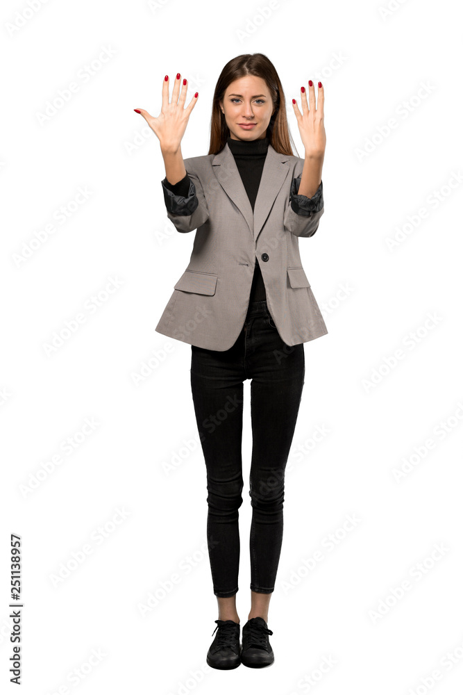 A full-length shot of a Business woman counting nine with fingers over isolated white background A full-length shot of a Business woman counting nine with fingers over isolated white background
