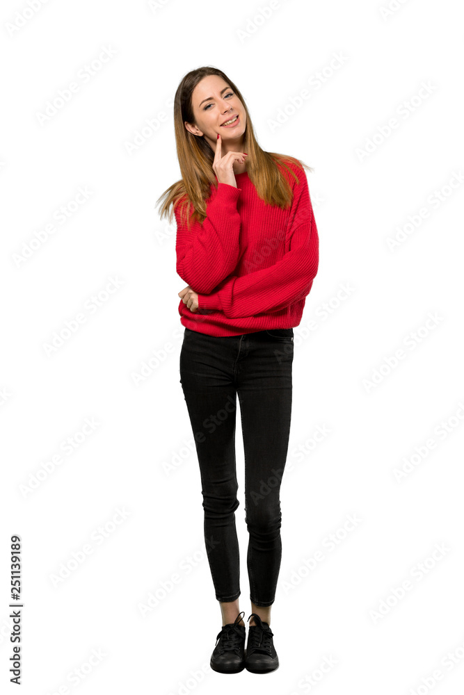 A full-length shot of a Young woman with red sweater thinking an idea while looking up over isolated white background A full-length shot of a Young woman with red sweater thinking an idea while looking up over isolated white background