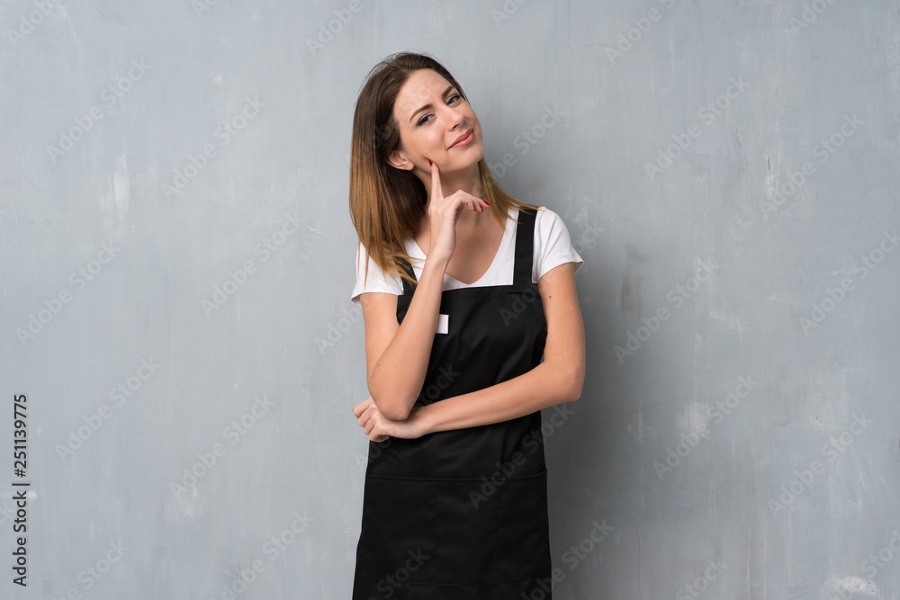 Employee woman thinking an idea while looking up Employee woman thinking an idea while looking up