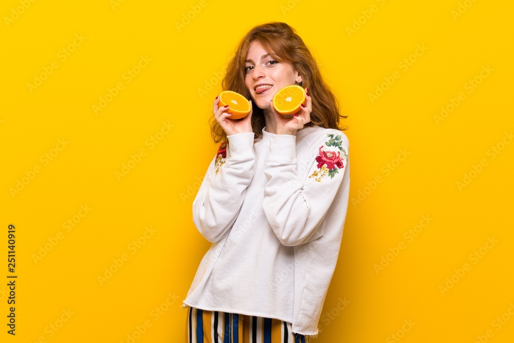 Young redhead woman with orange slices Young redhead woman with orange slices