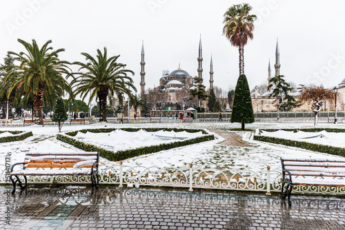Snowy day in Sultanahmet Square and Blue Mosque (Sultanahmet Camii). Istanbul, Turkey..