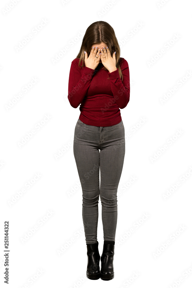 A full-length shot of a Teenager girl with turtleneck with tired and sick expression over isolated white background A full-length shot of a Teenager girl with turtleneck with tired and sick expression over isolated white background