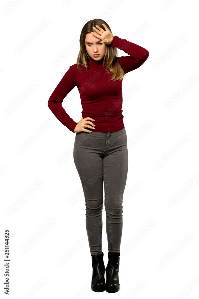 A full-length shot of a Teenager girl with turtleneck with tired and sick expression over isolated white background A full-length shot of a Teenager girl with turtleneck with tired and sick expression over isolated white background