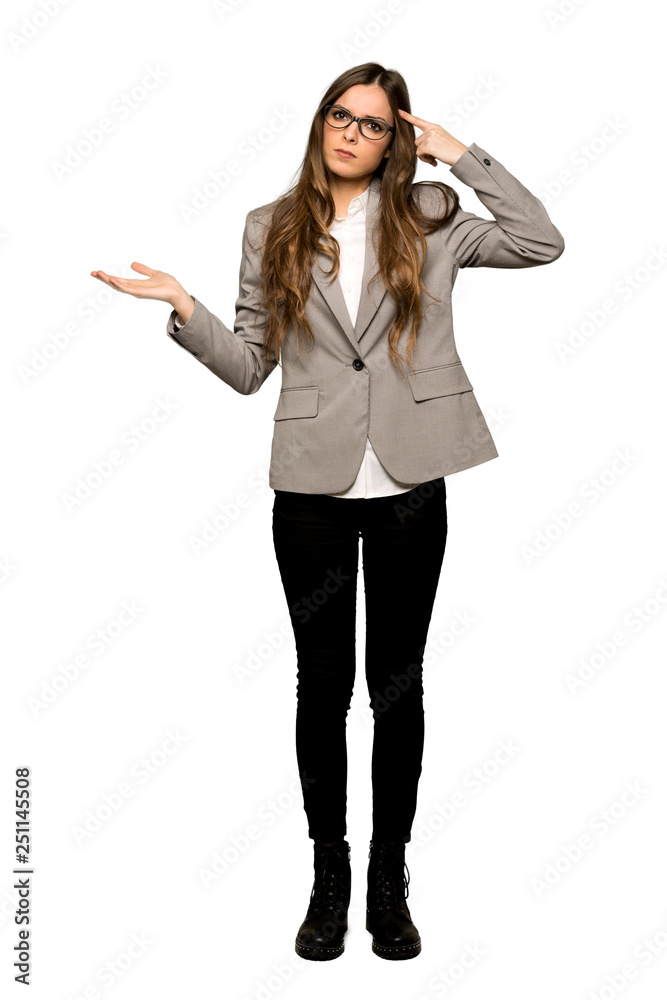 Full-length shot of Business woman making the gesture of madness putting finger on the head on isolated white background Full-length shot of Business woman making the gesture of madness putting finger on the head on isolated white background