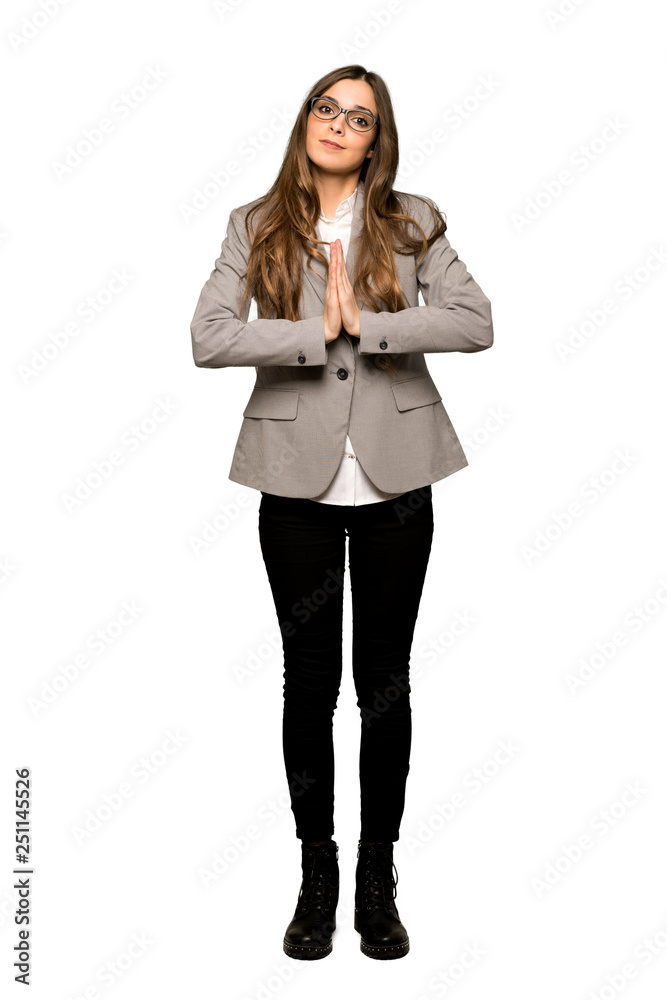 Full-length shot of Business woman keeps palm together. Person asks for something on isolated white background Full-length shot of Business woman keeps palm together. Person asks for something on isolated white background