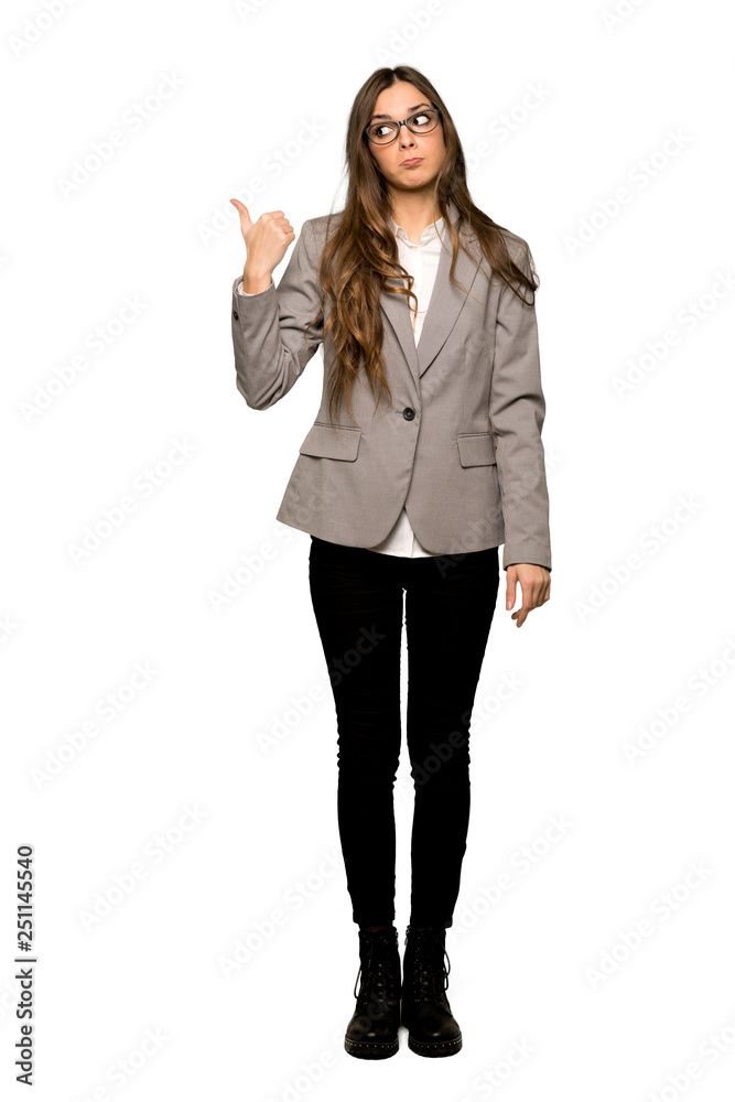 Full-length shot of Business woman unhappy and pointing to the side on isolated white background Full-length shot of Business woman unhappy and pointing to the side on isolated white background