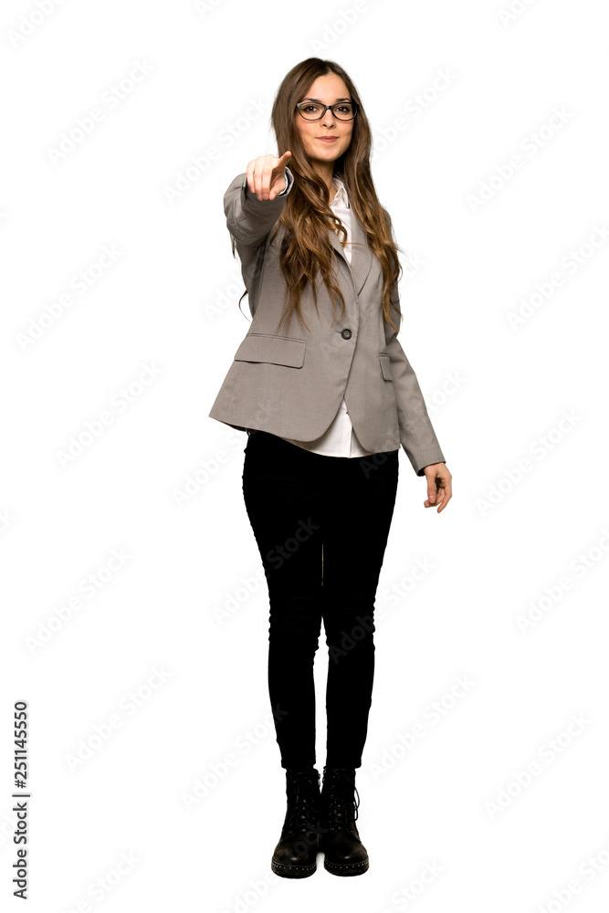 Full-length shot of Business woman points finger at you with a confident expression on isolated white background Full-length shot of Business woman points finger at you with a confident expression on isolated white background