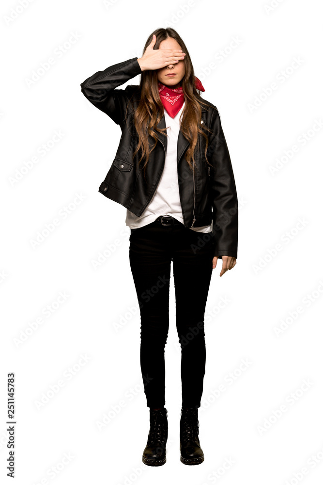 Full-length shot of Young woman with leather jacket covering eyes by hands. Do not want to see something on isolated white background Full-length shot of Young woman with leather jacket covering eyes by hands. Do not want to see something on isolated white background