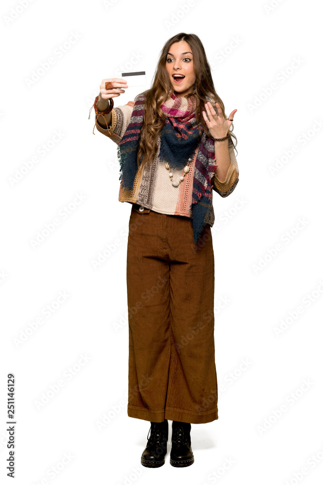 Full-length shot of Young hippie woman surprised and sending a message on isolated white background Full-length shot of Young hippie woman surprised and sending a message on isolated white background