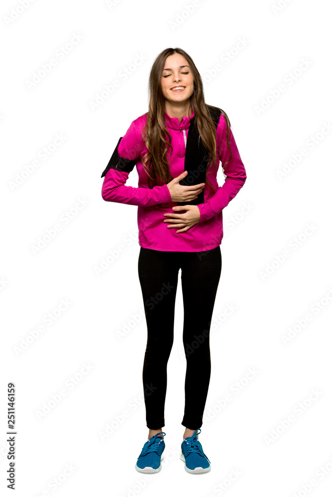 Full-length shot of Young sport woman smiling a lot while putting hands on chest over isolated white background Full-length shot of Young sport woman smiling a lot while putting hands on chest over isolated white background