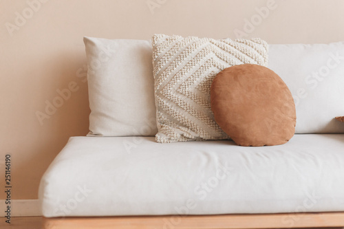 Fototapeta Naklejka Na Ścianę i Meble -  White square pillow on white sofa