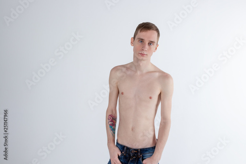 Young serious man posing and looking at camera