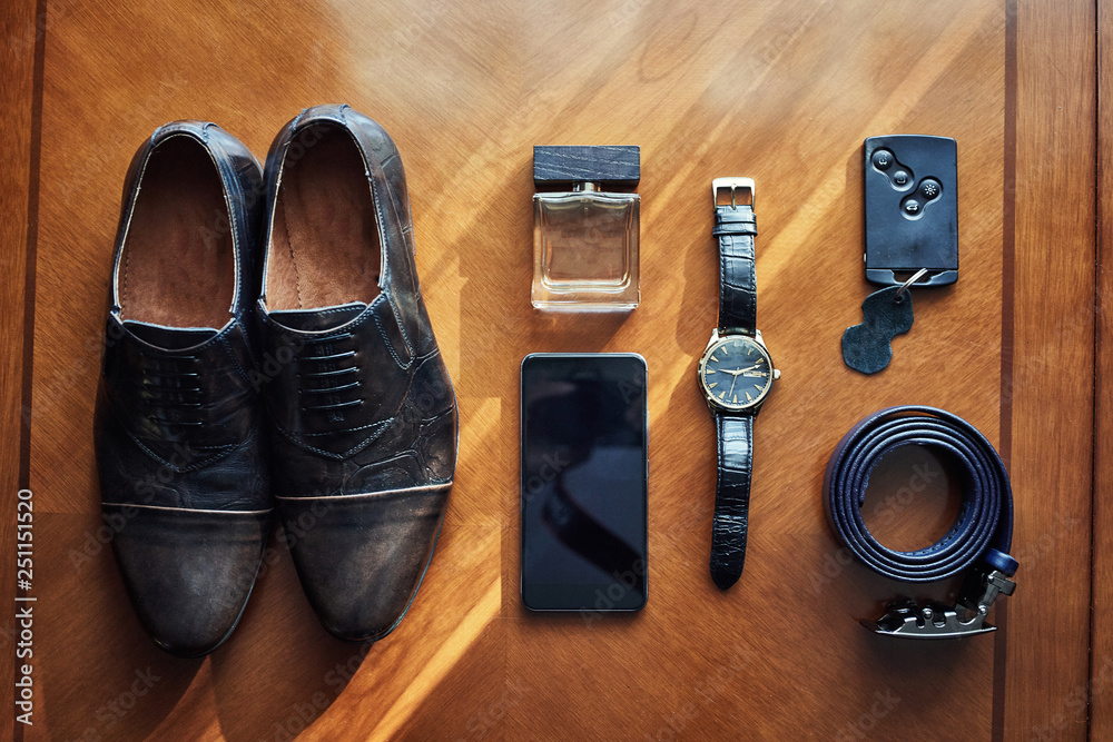different accessories of a businessman for creating a style of a people lie on a wooden background different accessories of a businessman for creating a style of a people lie on a wooden background