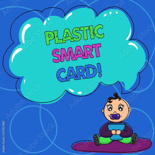 Conceptual hand writing showing Plastic Smart Card. Business photo text security token that has embedded intelligent chip Baby Sitting on Rug with Pacifier Book and Cloud Speech Bubble