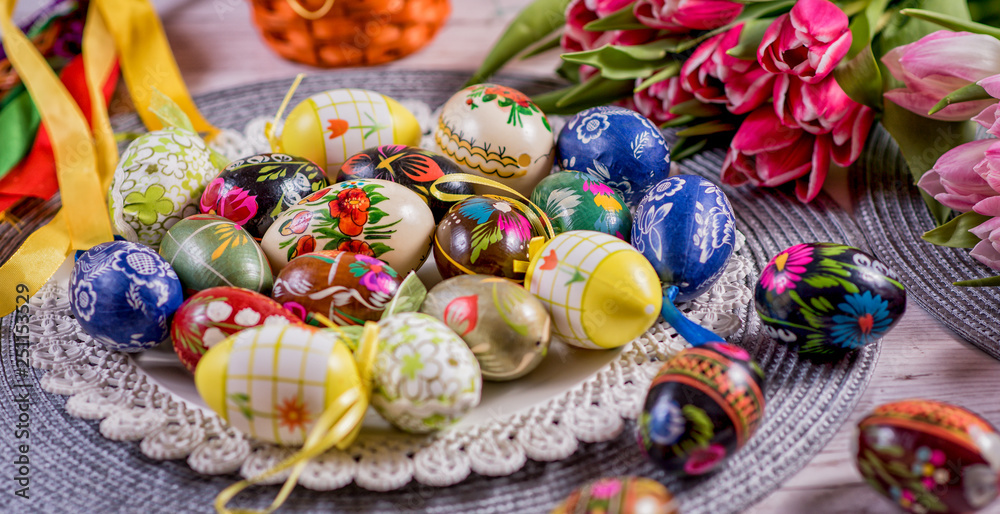 Multicolored spring tulips and Easter eggs with decorations
