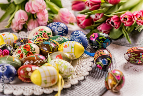 Multicolored spring tulips and Easter eggs with decorations