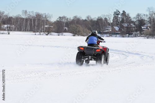 ATV on ice with snow before turning