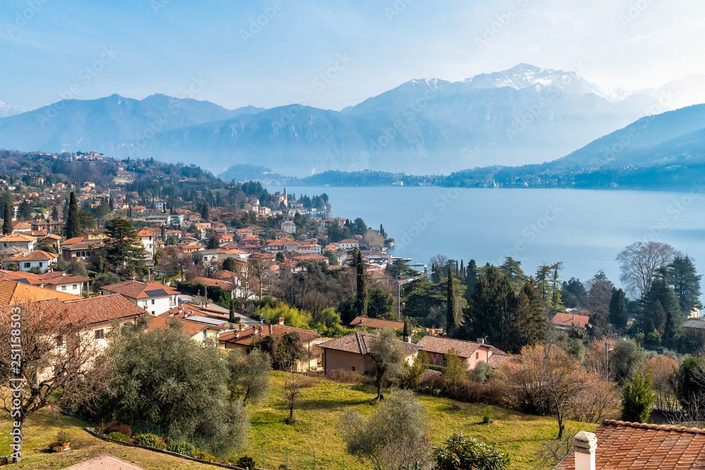 Panoramic view of Lake Como and Tremezzo village with a slight haze on the background, Italy