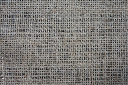 Natural burlap fabric on a black background