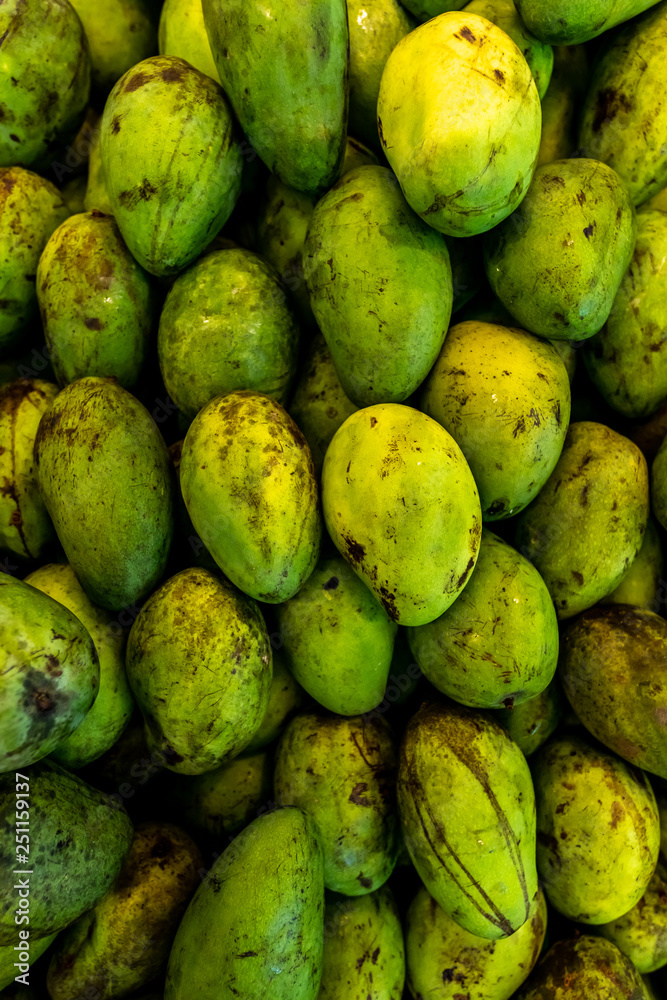 Fresh exotic tropical fruit green mano for sale on a local market, Bali island. Fresh exotic tropical fruit green mano for sale on a local market, Bali island.