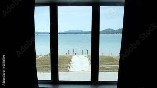 Фотография View of a window with seaview