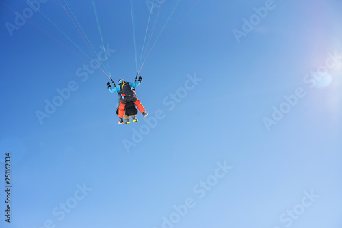 Paragliding, cloudless blue sky