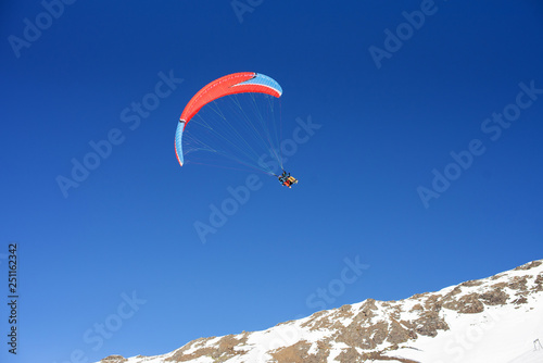 Paragliding, cloudless blue sky