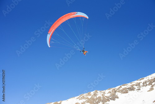 Paragliding, cloudless blue sky