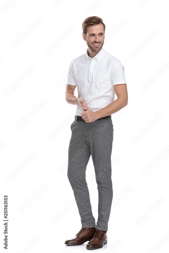 side view of a smiling casual man holding palms together side view of a smiling casual man holding palms together
