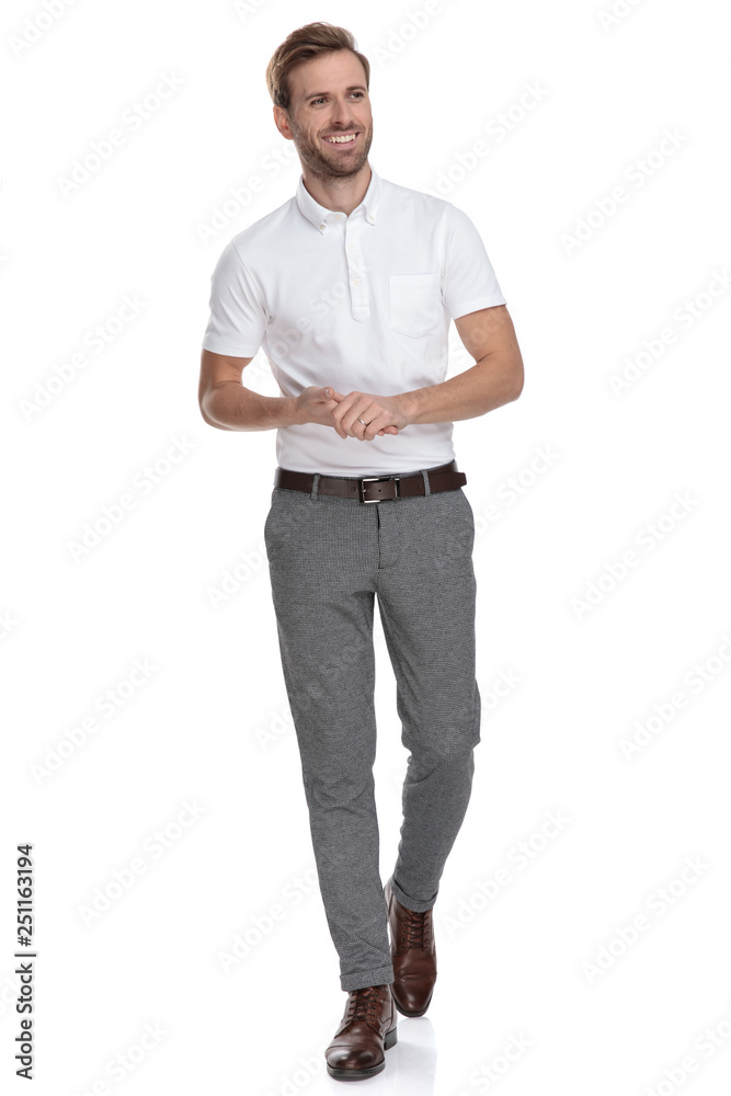 laughing man holding palms together walks and looks to side laughing man holding palms together walks and looks to side