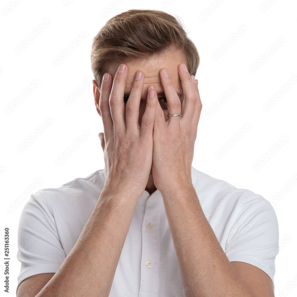 man covering his face with his palms man covering his face with his palms